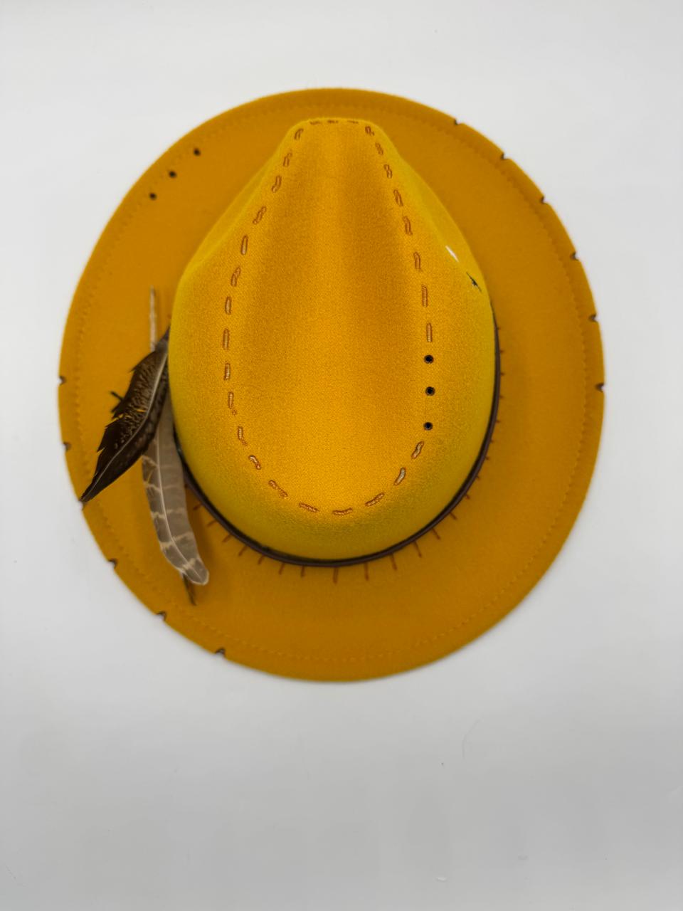 Yellow mustard fedora with feathers and carving