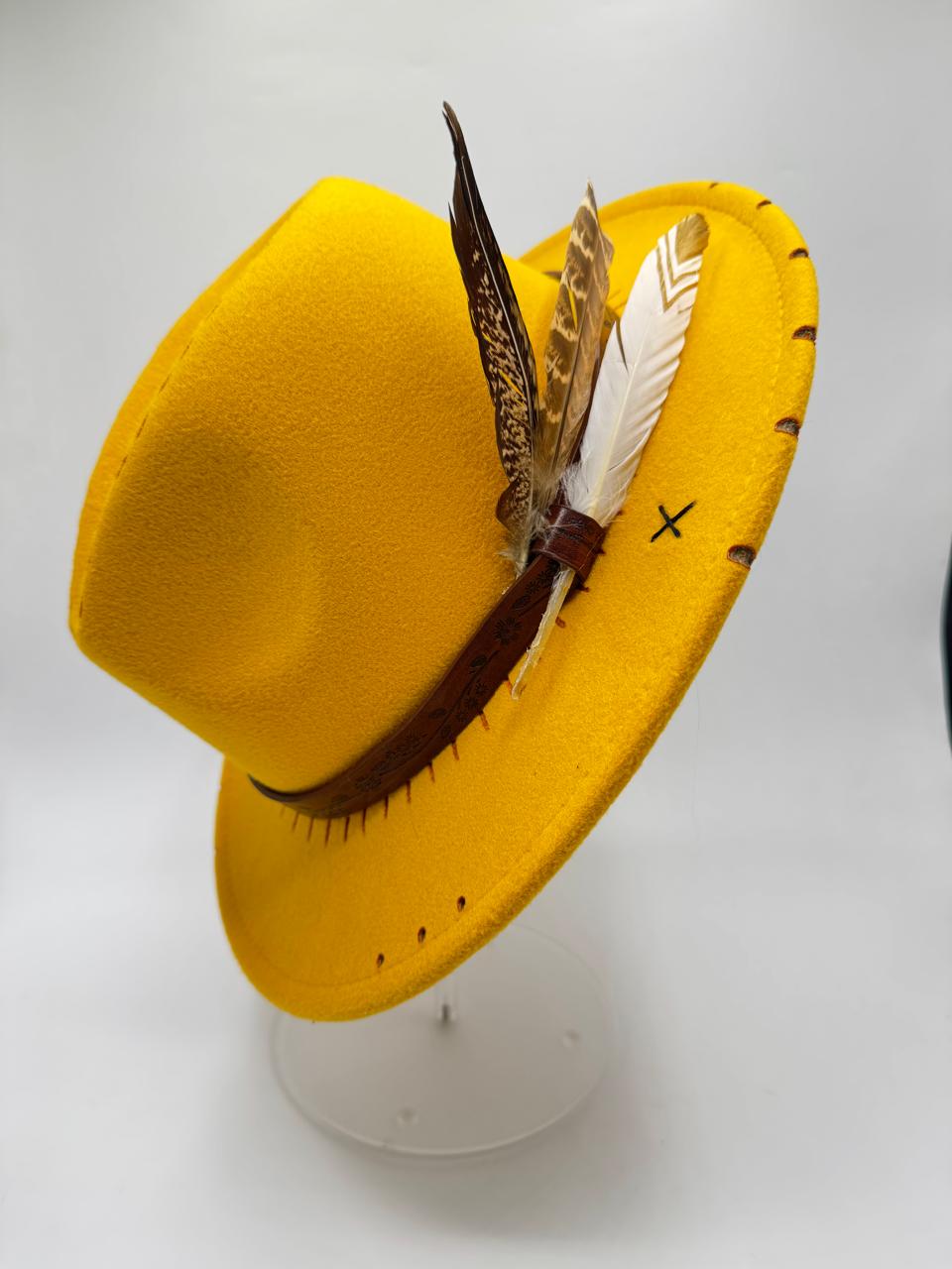 Yellow mustard fedora with feathers and carving