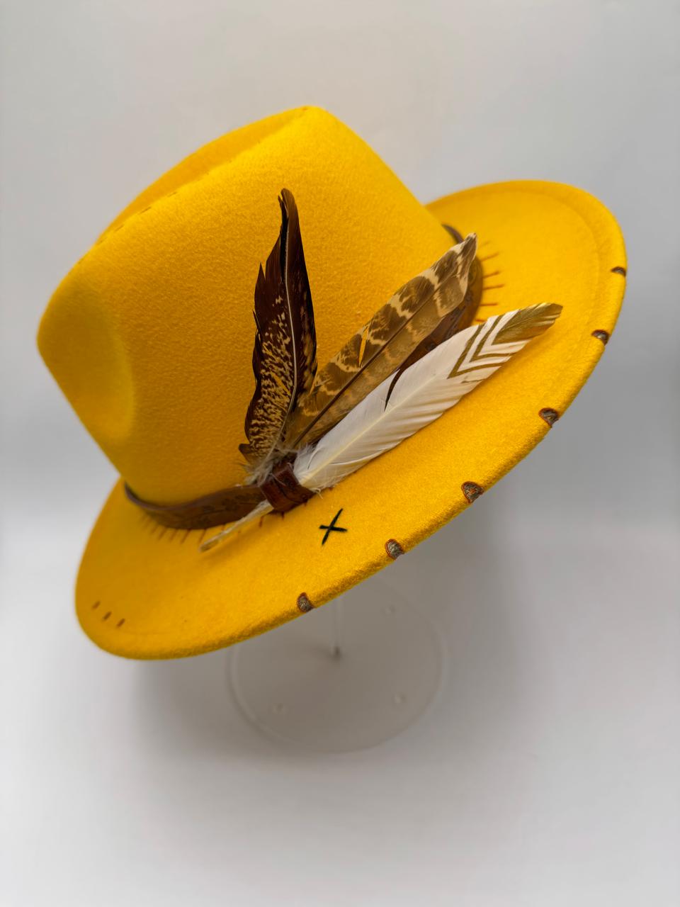 Yellow mustard fedora with feathers and carving