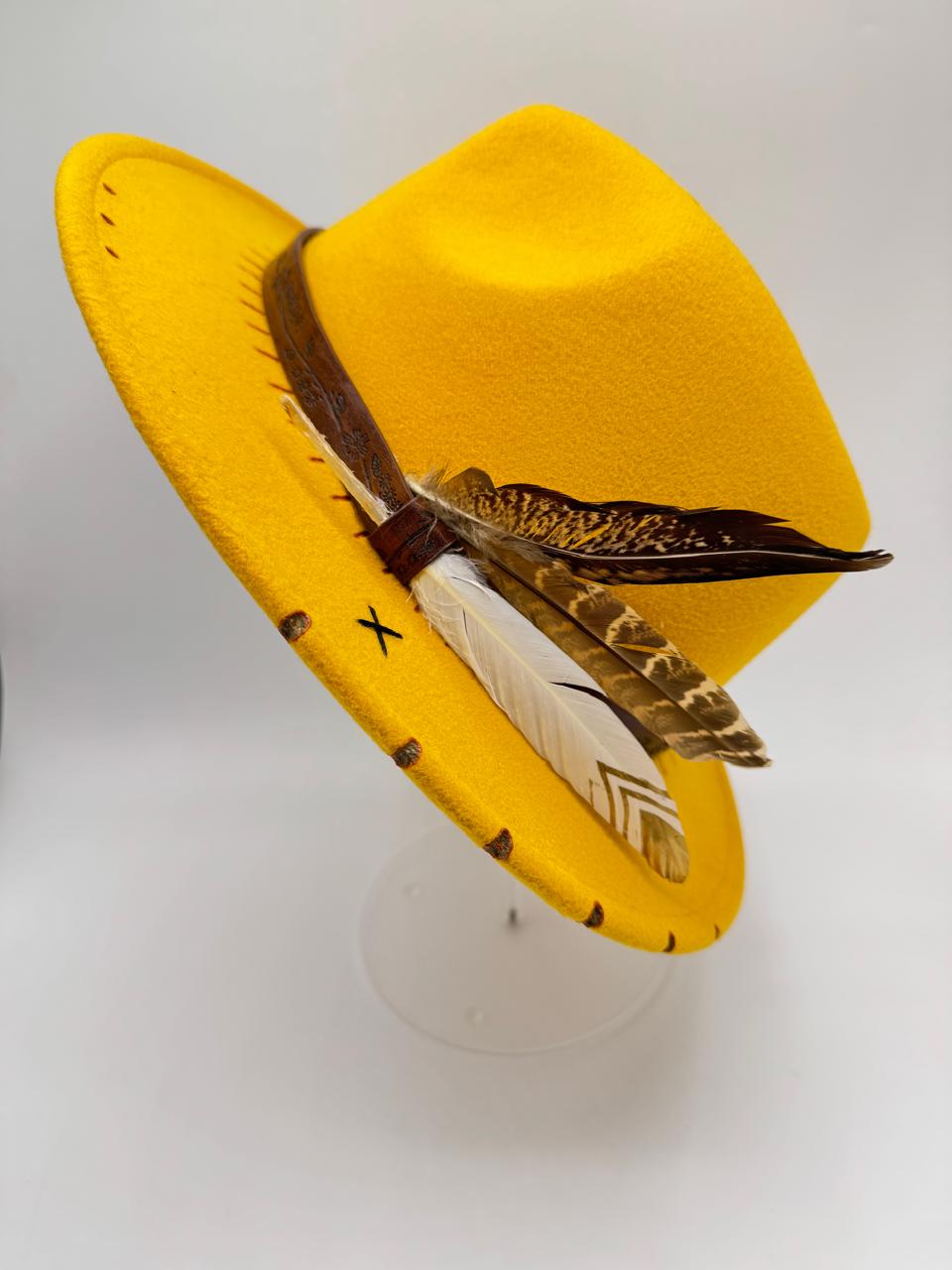 Yellow mustard fedora with feathers and carving