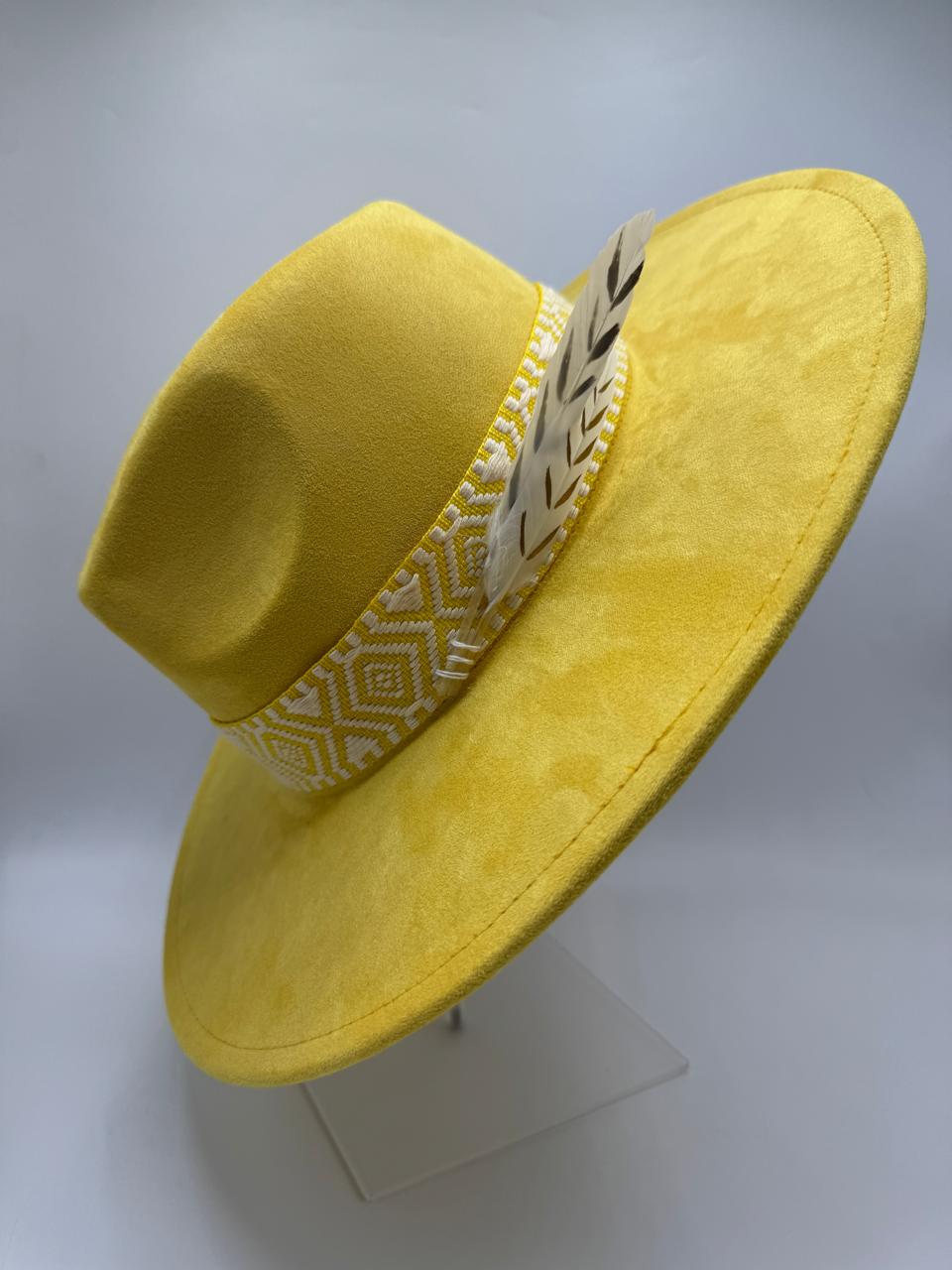 yellow wide brim fedora with feathers