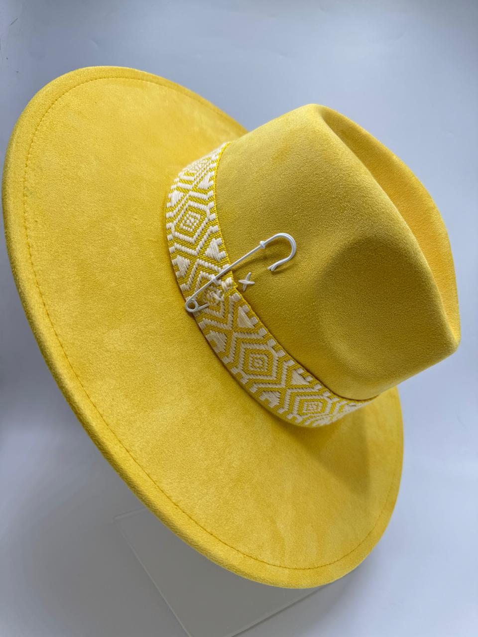 yellow wide brim fedora with feathers