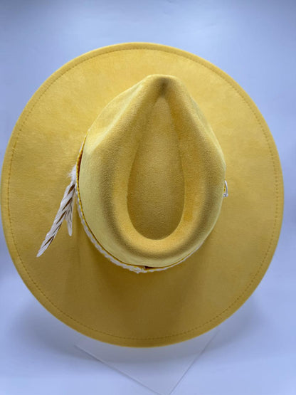 yellow wide brim fedora with feathers