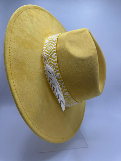 yellow wide brim fedora with feathers